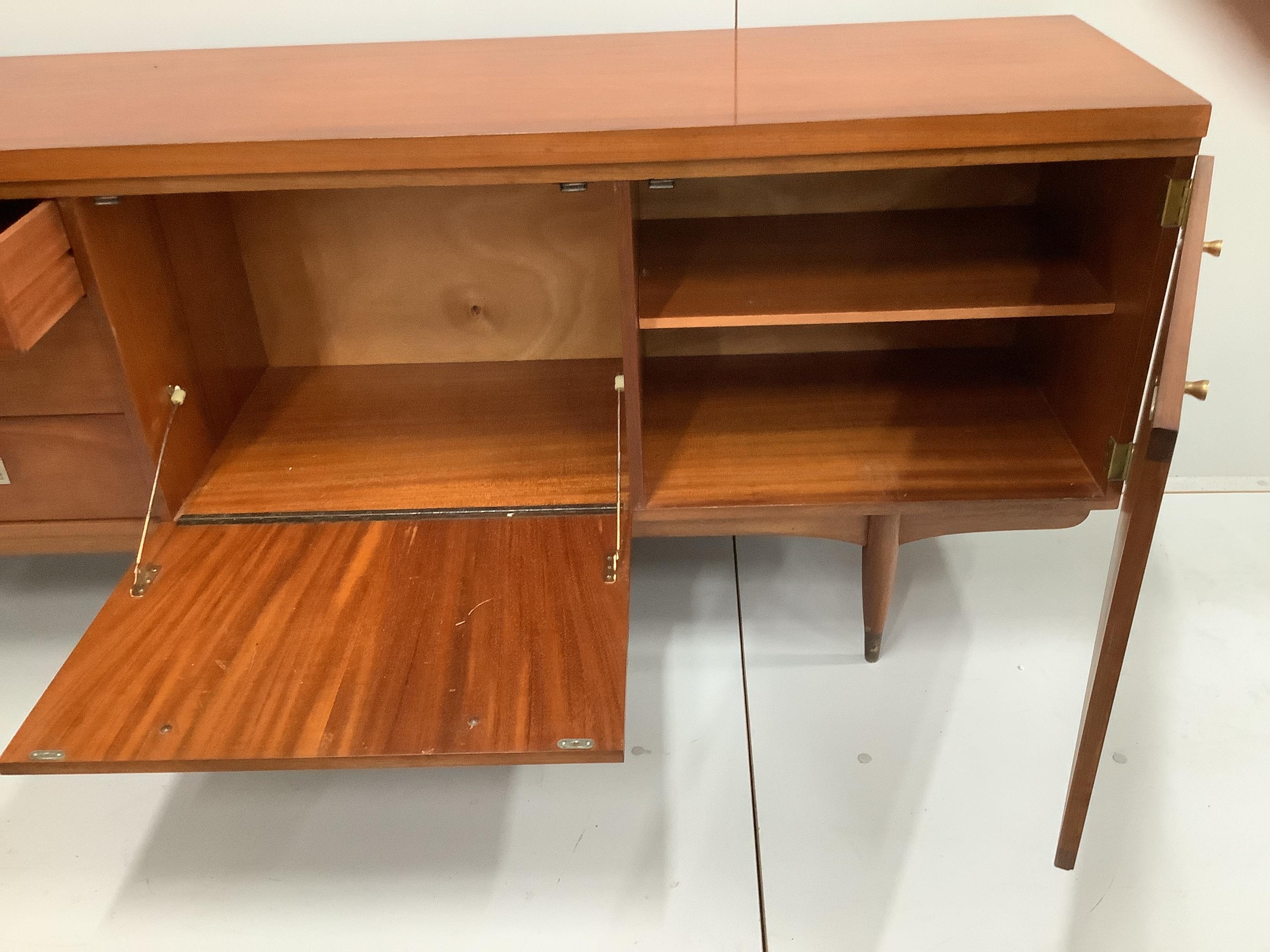 A Greaves and Thomas mid century teak sideboard, width 220cm, depth 45cm, height 76cm
